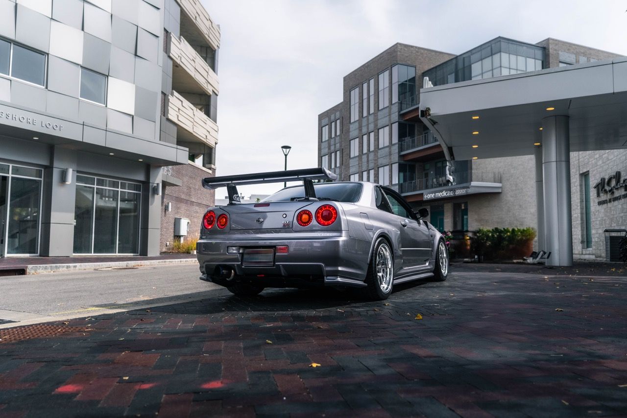 R34 GTR with Motivo Forged CS-E custom wheels in frozen brushed gunmetal face and gloss polished clear lip side view — view 46