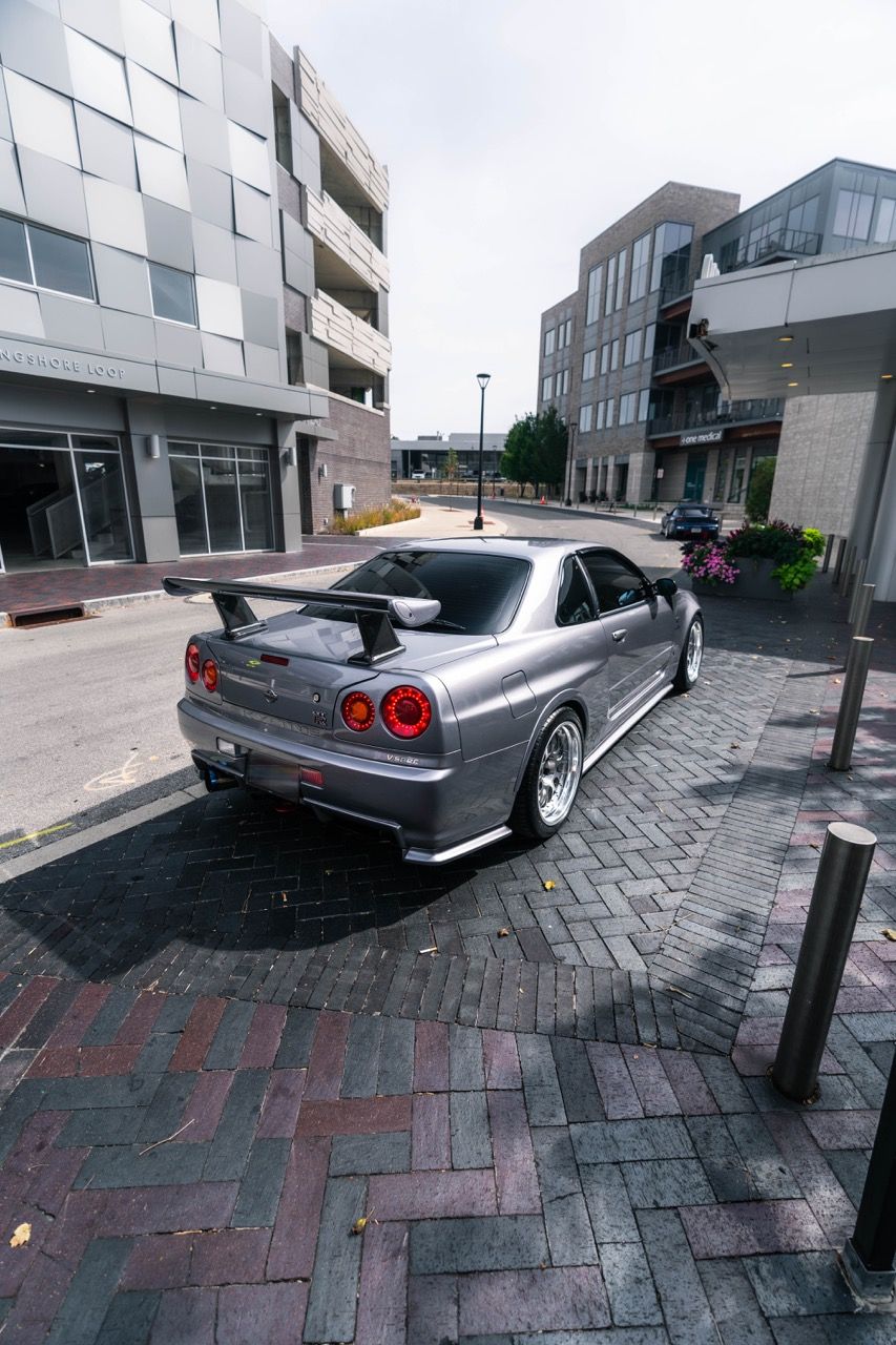 R34 GTR with Motivo Forged CS-E custom wheels in frozen brushed gunmetal face and gloss polished clear lip side view — view 37