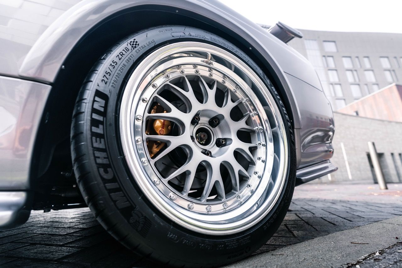 R34 GTR with Motivo Forged CS-E custom wheels in frozen brushed gunmetal face and gloss polished clear lip side view — view 42