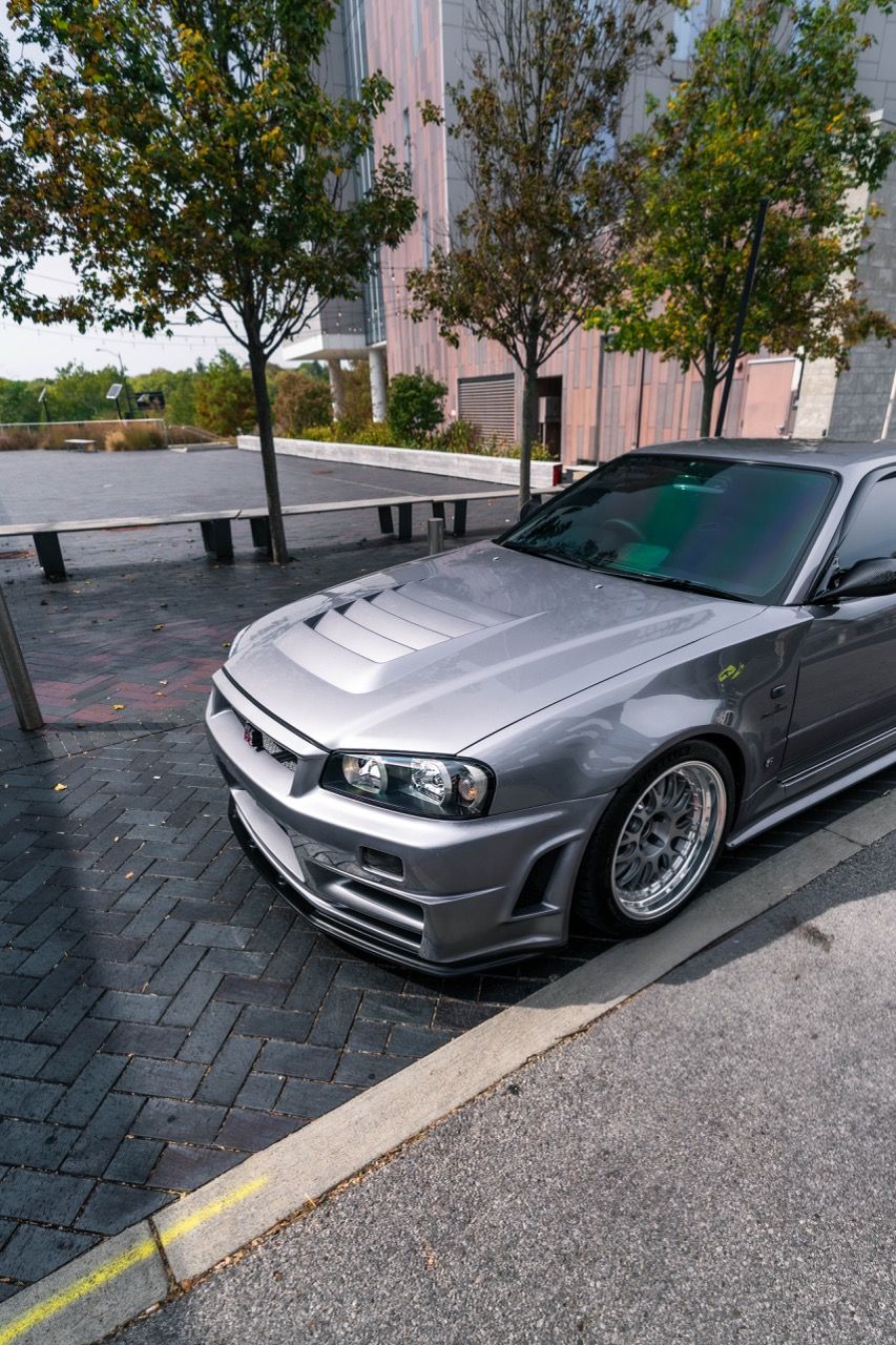 R34 GTR with Motivo Forged CS-E custom wheels in frozen brushed gunmetal face and gloss polished clear lip side view — view 19