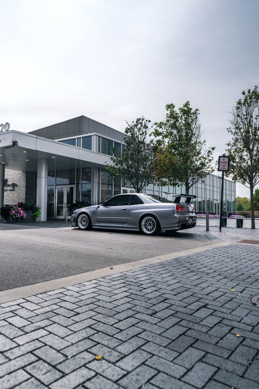 R34 GTR with Motivo Forged CS-E custom wheels in frozen brushed gunmetal face and gloss polished clear lip side view — view 17