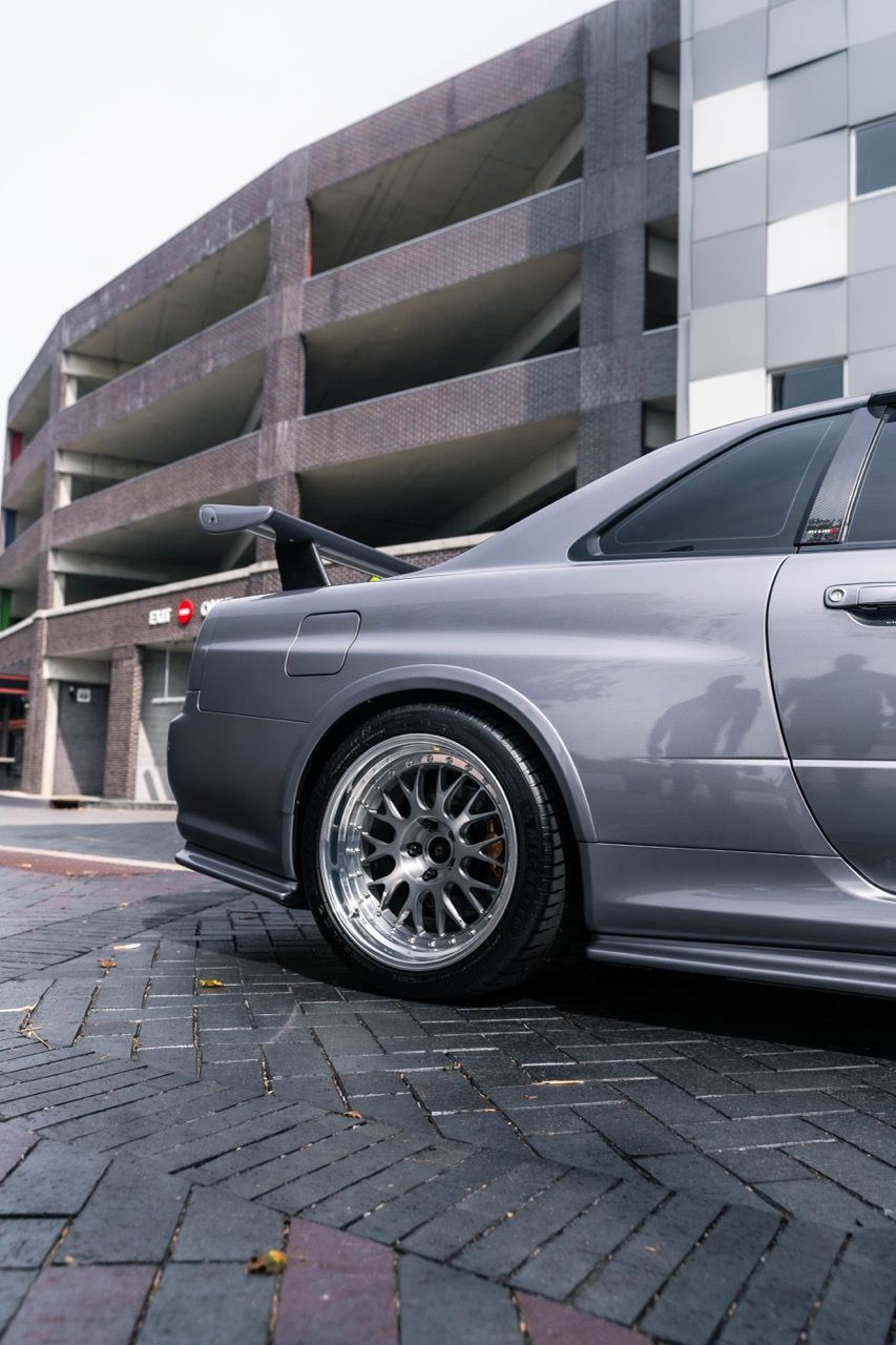 R34 GTR with Motivo Forged CS-E custom wheels in frozen brushed gunmetal face and gloss polished clear lip side view — view 26