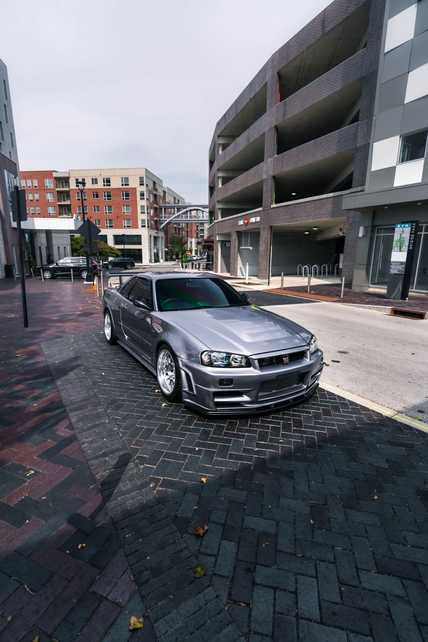 R34 GTR with Motivo Forged CS-E custom wheels in frozen brushed gunmetal face and gloss polished clear lip side view — view 8