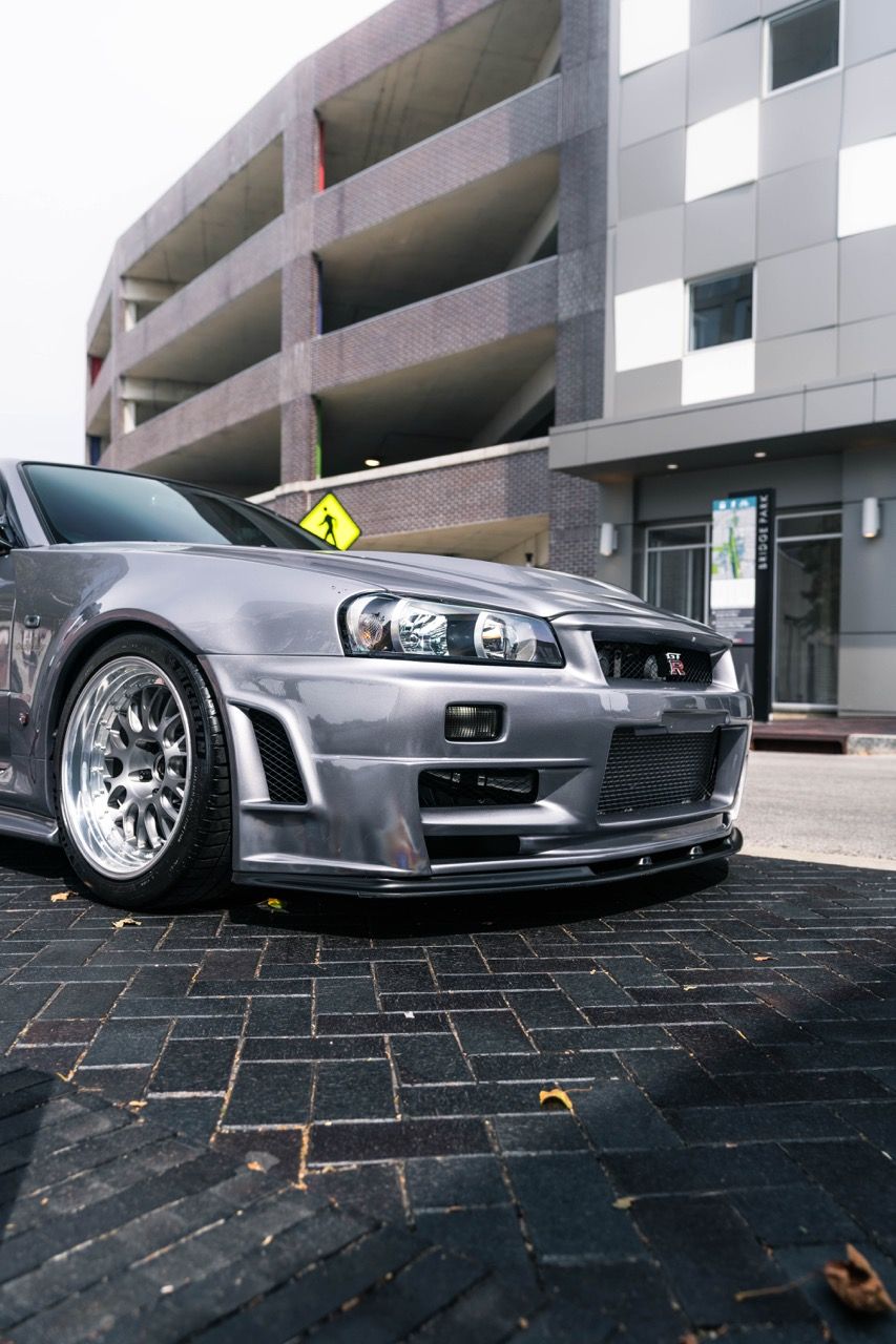 R34 GTR with Motivo Forged CS-E custom wheels in frozen brushed gunmetal face and gloss polished clear lip side view — view 20