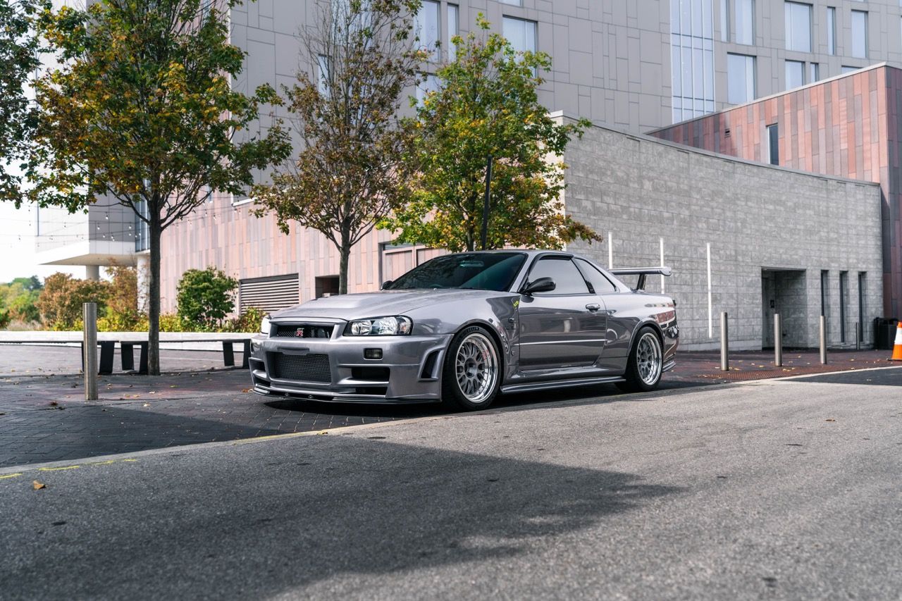 R34 GTR with Motivo Forged CS-E custom wheels in frozen brushed gunmetal face and gloss polished clear lip side view — view 2