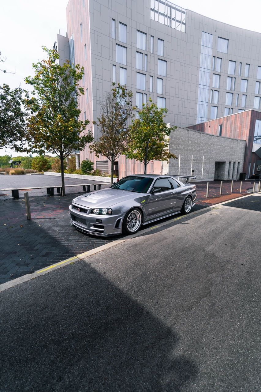 R34 GTR with Motivo Forged CS-E custom wheels in frozen brushed gunmetal face and gloss polished clear lip side view — view 9