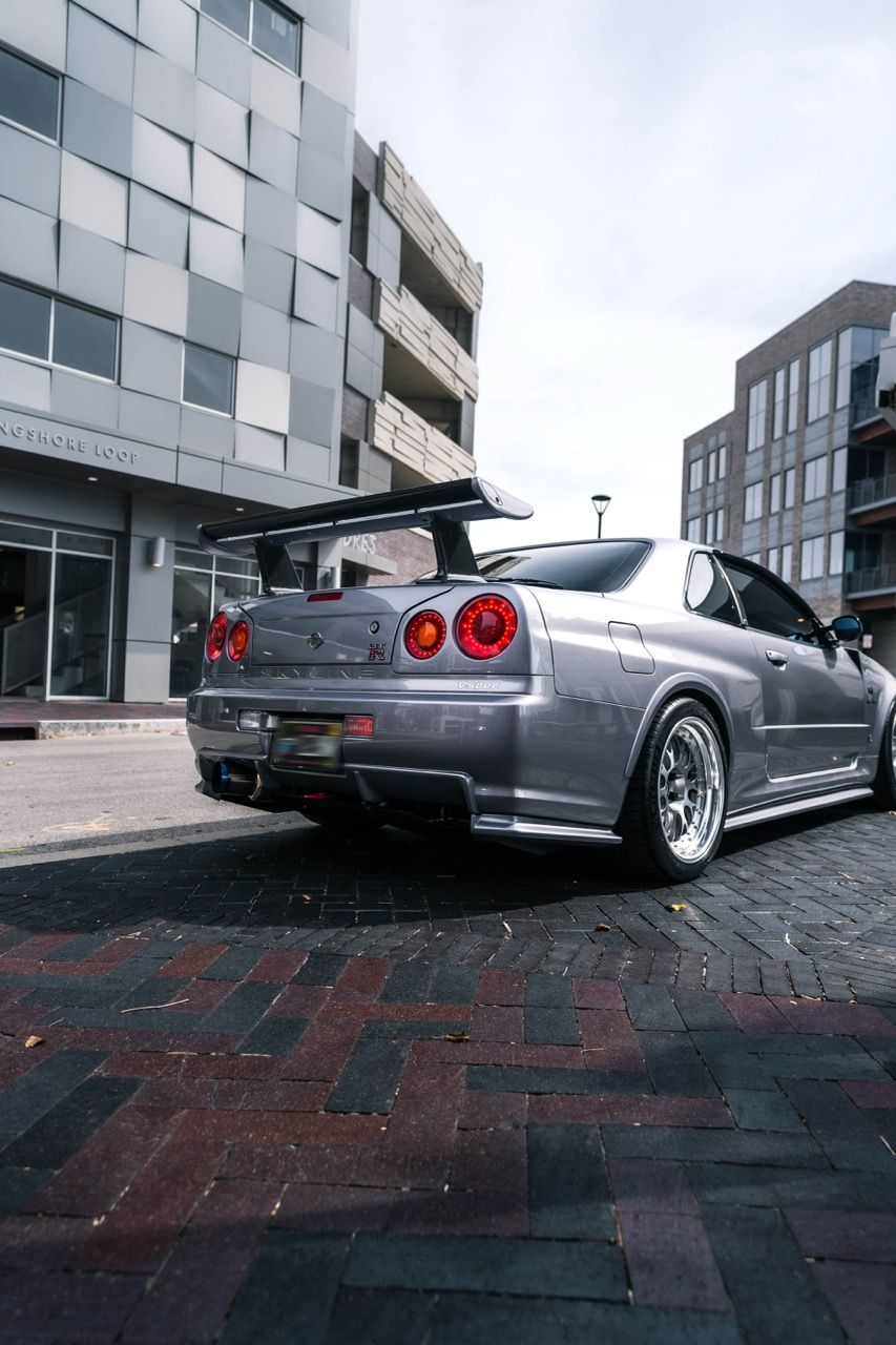 R34 GTR with Motivo Forged CS-E custom wheels in frozen brushed gunmetal face and gloss polished clear lip side view — view 6