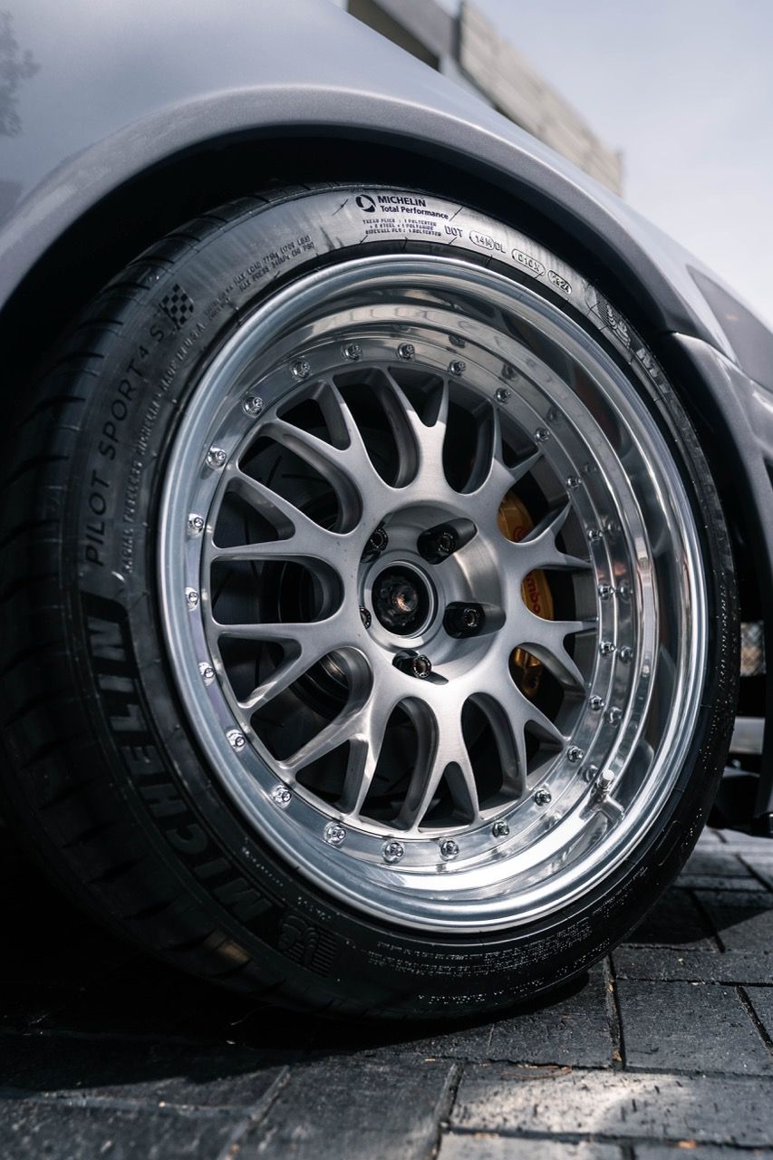 R34 GTR with Motivo Forged CS-E custom wheels in frozen brushed gunmetal face and gloss polished clear lip side view — view 11