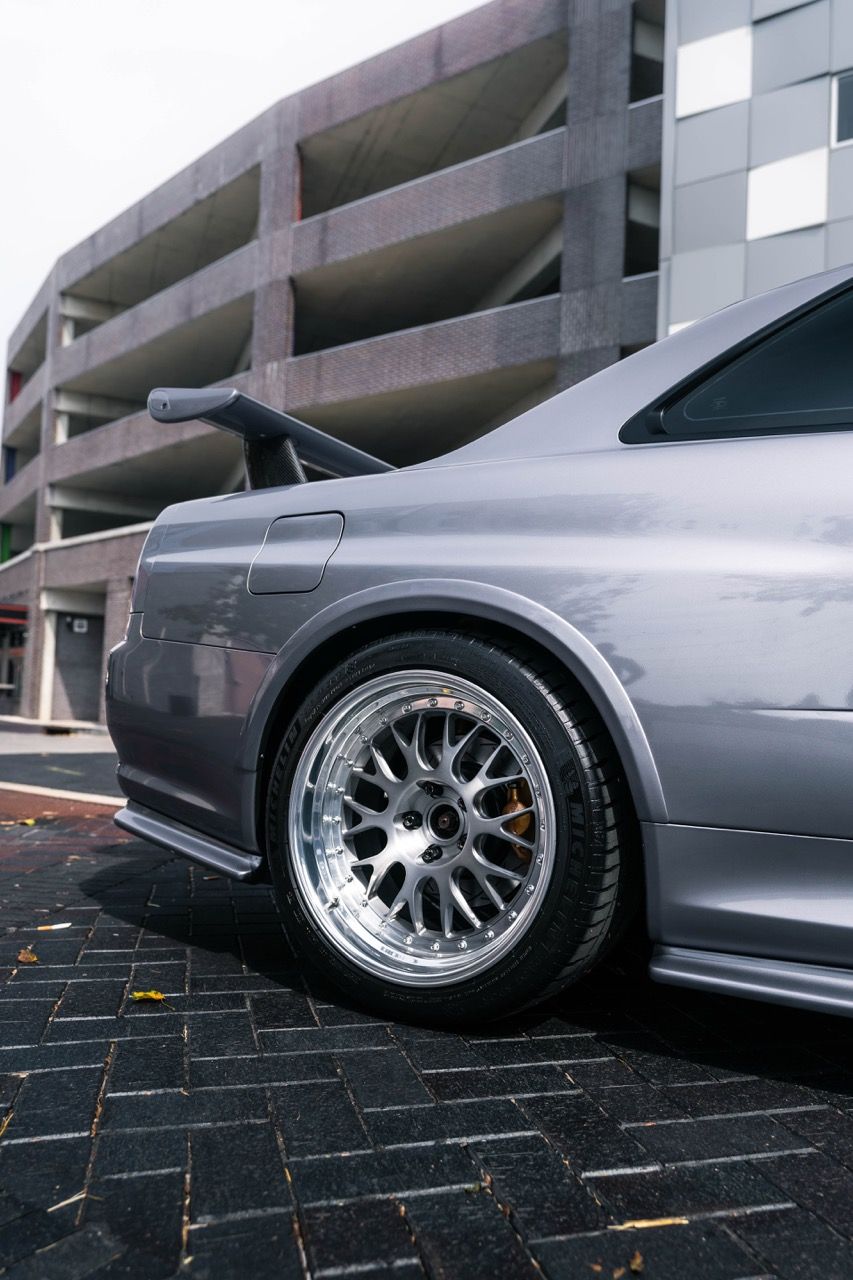 R34 GTR with Motivo Forged CS-E custom wheels in frozen brushed gunmetal face and gloss polished clear lip side view — view 7