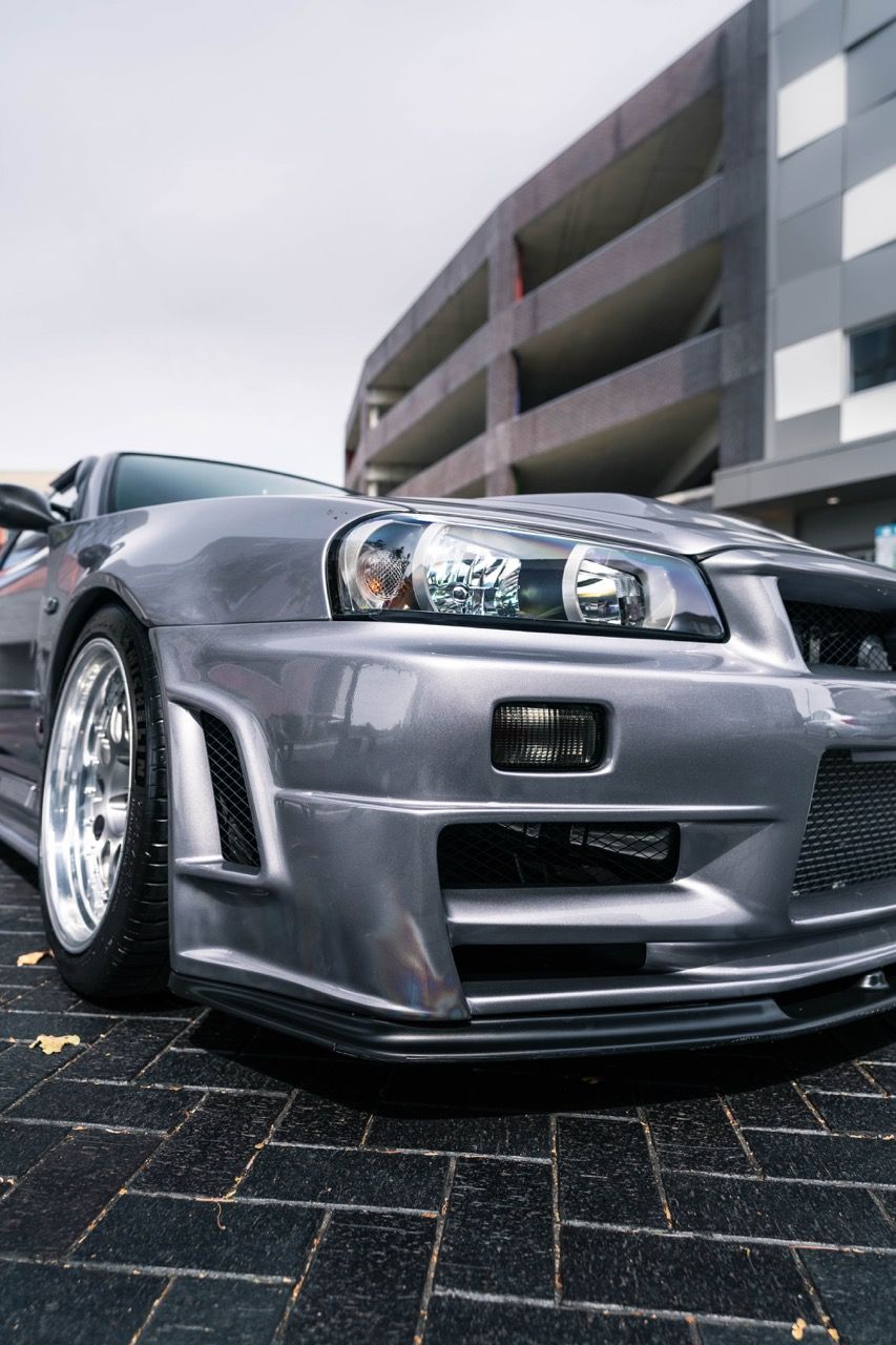 R34 GTR with Motivo Forged CS-E custom wheels in frozen brushed gunmetal face and gloss polished clear lip side view — view 30