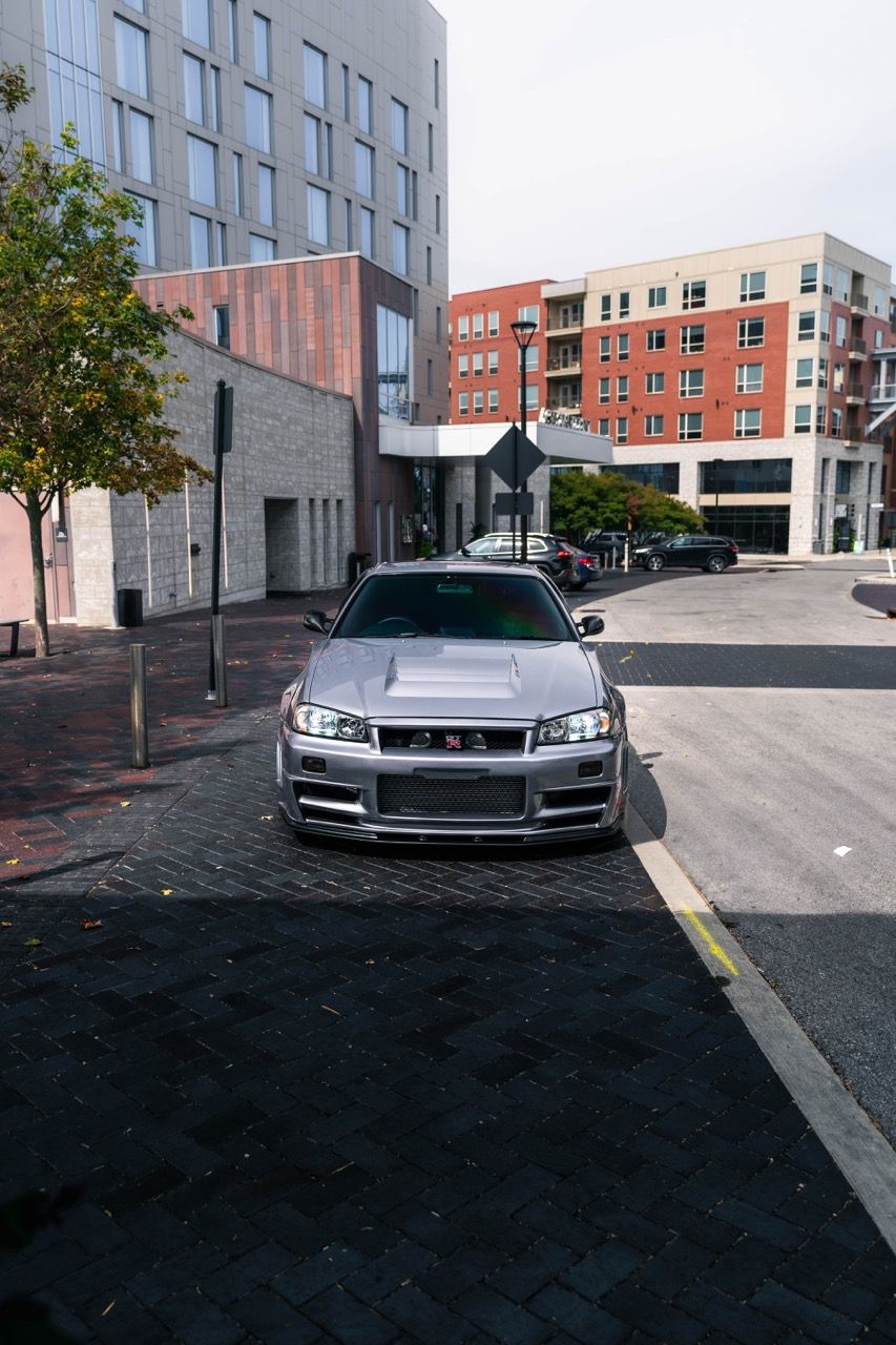 R34 GTR with Motivo Forged CS-E custom wheels in frozen brushed gunmetal face and gloss polished clear lip side view — view 24