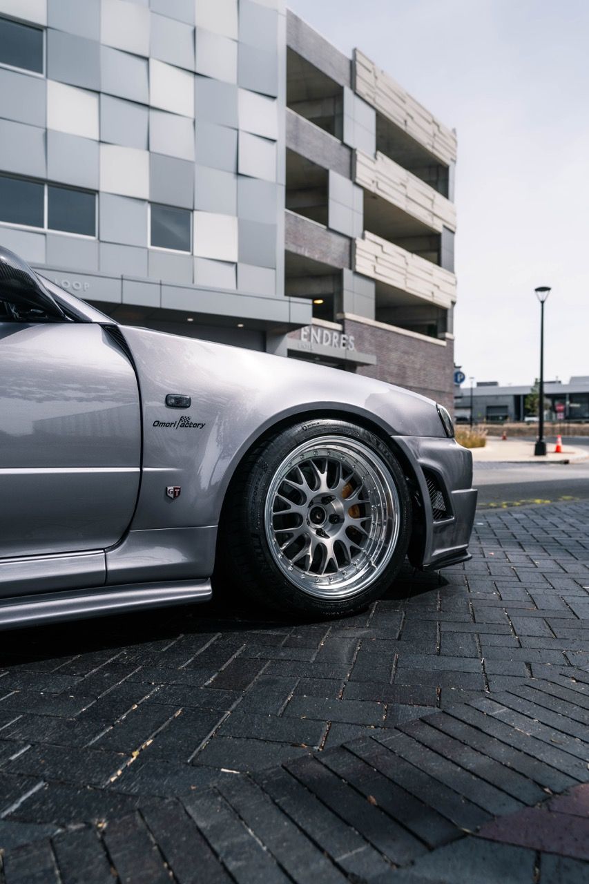 R34 GTR with Motivo Forged CS-E custom wheels in frozen brushed gunmetal face and gloss polished clear lip side view — view 25