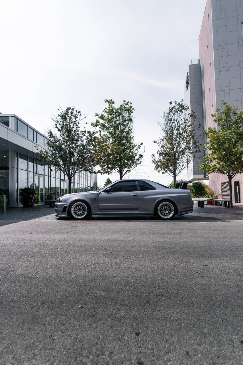 R34 GTR with Motivo Forged CS-E custom wheels in frozen brushed gunmetal face and gloss polished clear lip side view — view 31