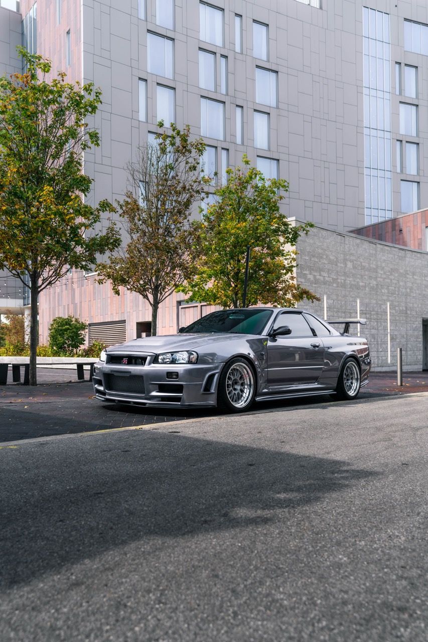 R34 GTR with Motivo Forged CS-E custom wheels in frozen brushed gunmetal face and gloss polished clear lip side view — view 47