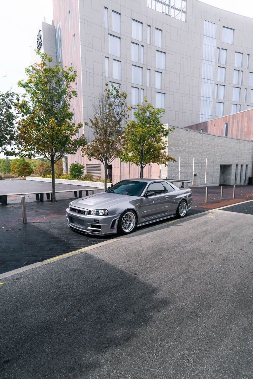R34 GTR with Motivo Forged CS-E custom wheels in frozen brushed gunmetal face and gloss polished clear lip side view — view 13