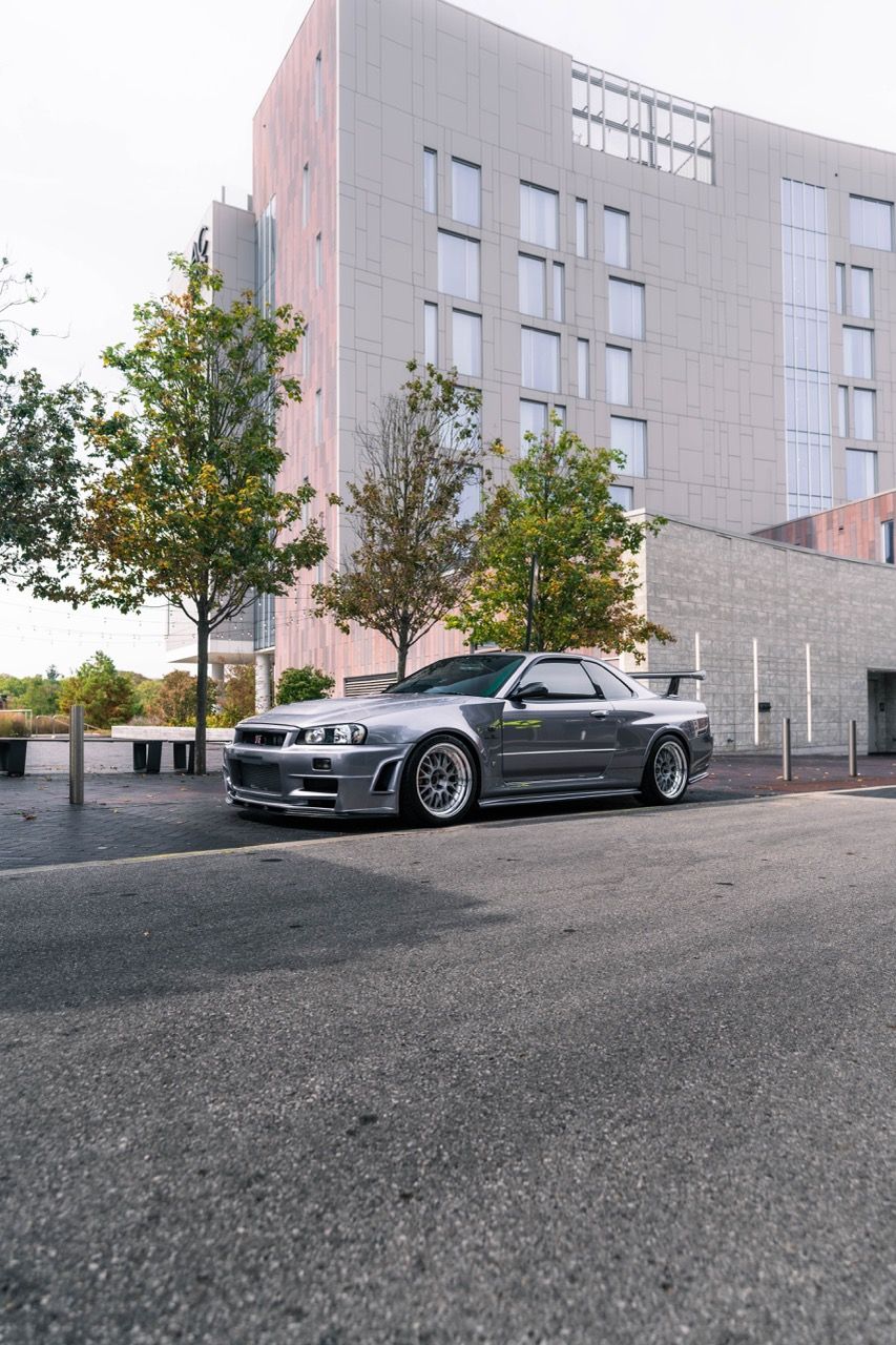 R34 GTR with Motivo Forged CS-E custom wheels in frozen brushed gunmetal face and gloss polished clear lip side view — view 15