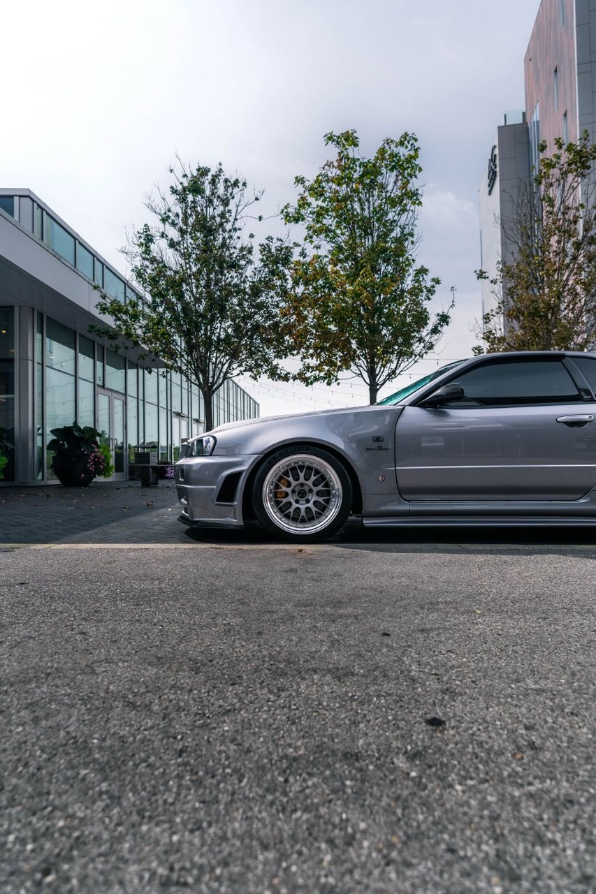 R34 GTR with Motivo Forged CS-E custom wheels in frozen brushed gunmetal face and gloss polished clear lip side view — view 33