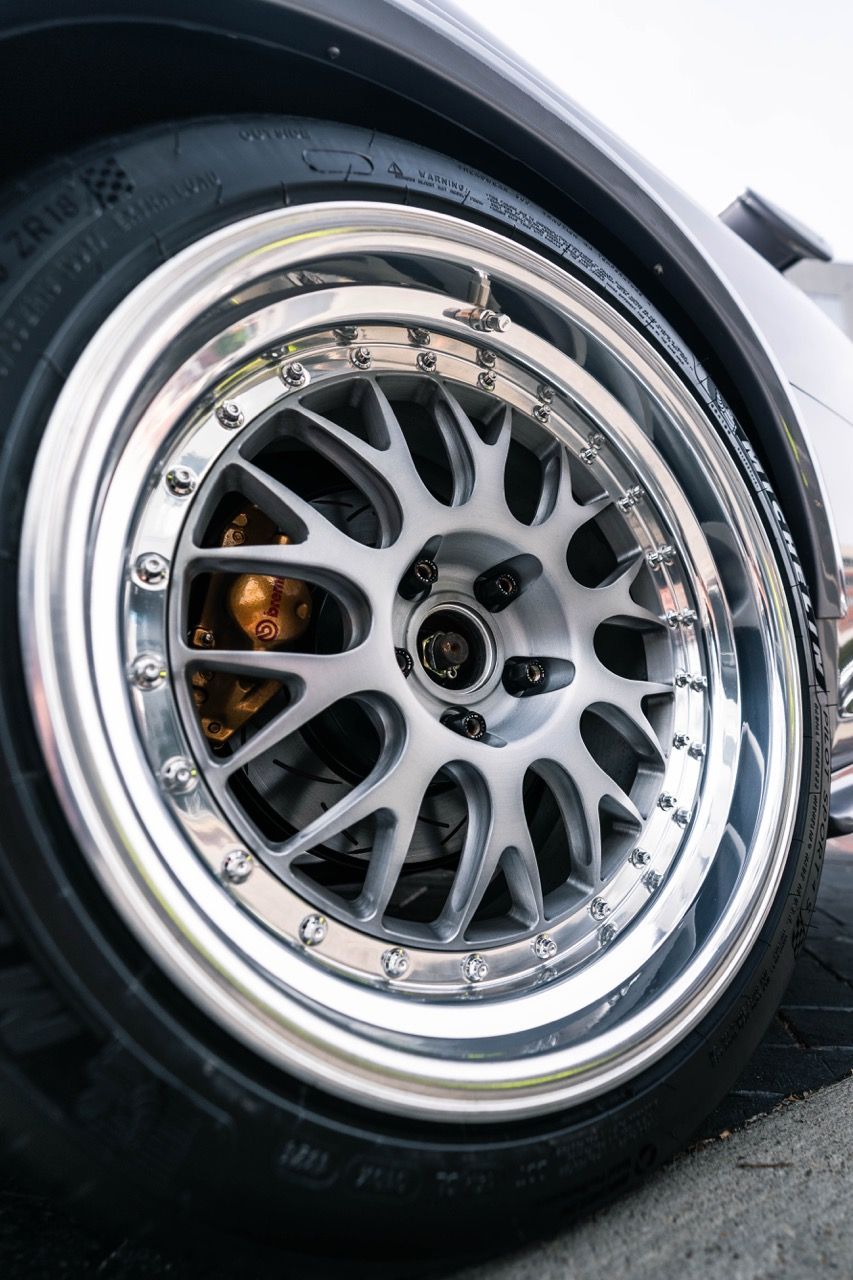 R34 GTR with Motivo Forged CS-E custom wheels in frozen brushed gunmetal face and gloss polished clear lip side view — view 39