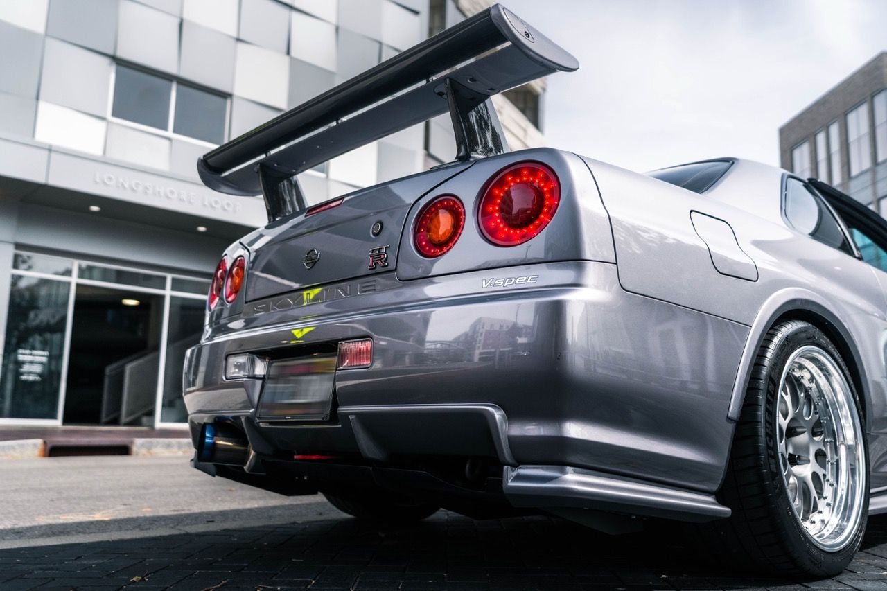 R34 GTR with Motivo Forged CS-E custom wheels in frozen brushed gunmetal face and gloss polished clear lip side view — view 49