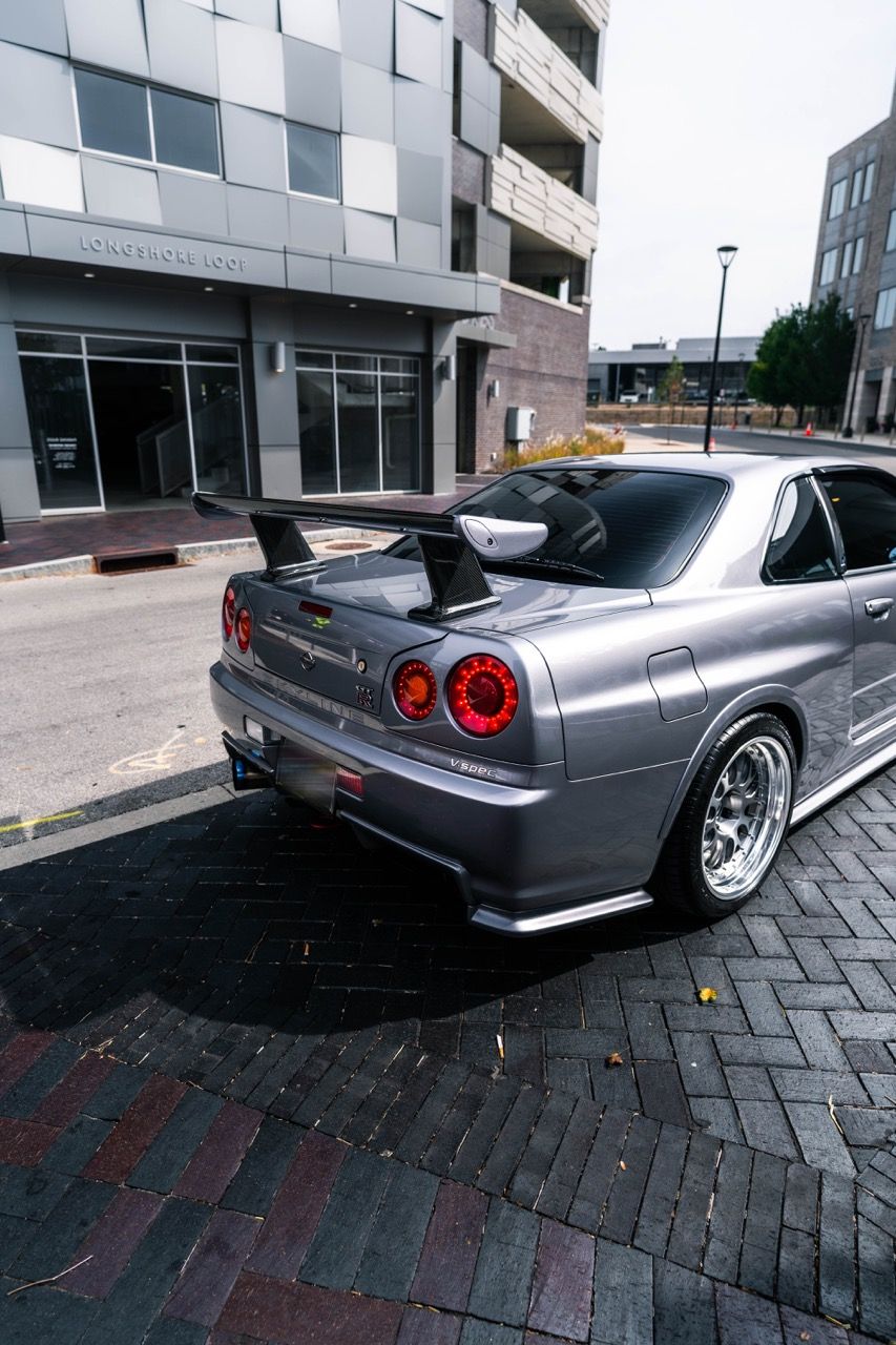 R34 GTR with Motivo Forged CS-E custom wheels in frozen brushed gunmetal face and gloss polished clear lip side view — view 28