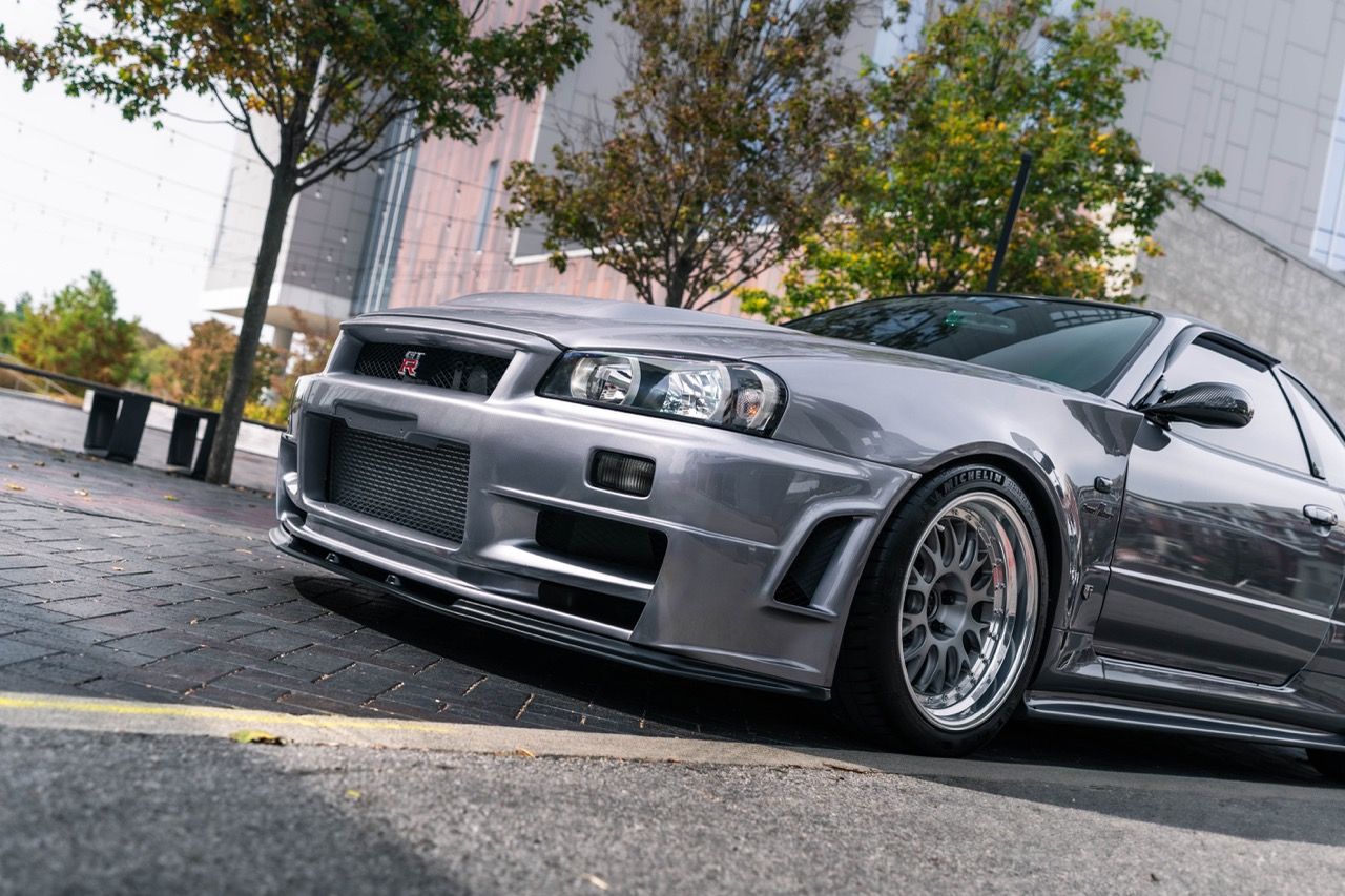 R34 GTR with Motivo Forged CS-E custom wheels in frozen brushed gunmetal face and gloss polished clear lip side view — view 44
