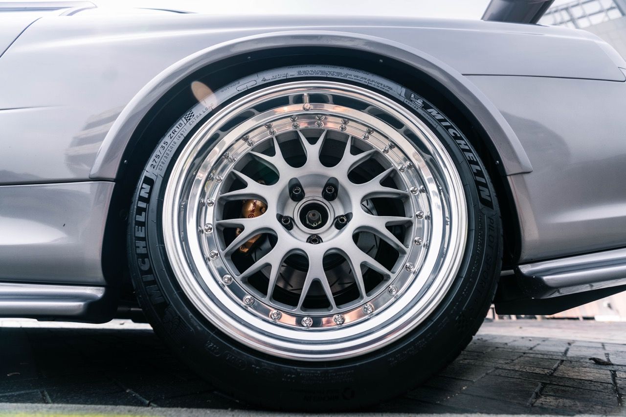 R34 GTR with Motivo Forged CS-E custom wheels in frozen brushed gunmetal face and gloss polished clear lip side view — view 38
