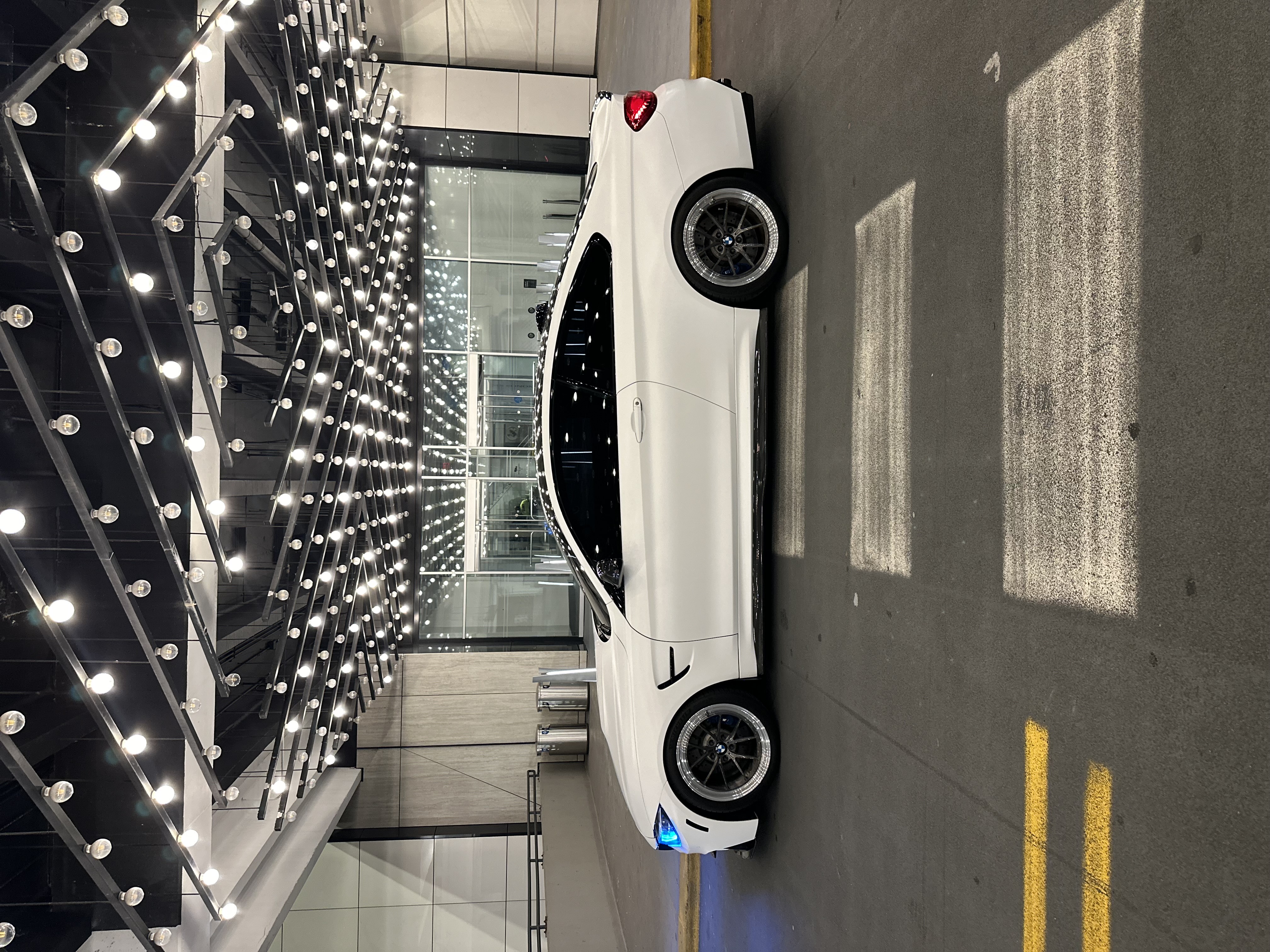 BMW M4 F82 with Motivo Forged MB-C Comp Spec custom wheels in gloss brushed gunmetal face and gloss polished clear lip side view — view 5