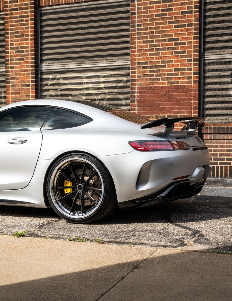 Mercedes-Benz AMG GTR with Motivo Forged CS-N custom wheels in frozen black face and gloss polished clear lip rear side view