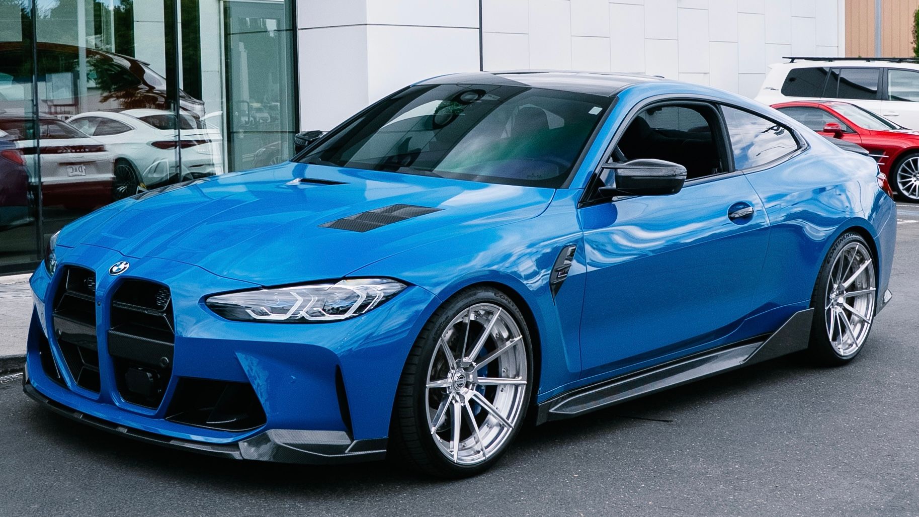 BMW M4 with Motivo Forged CS-U custom wheels in gloss polished clear face and brushed clear barrel side view