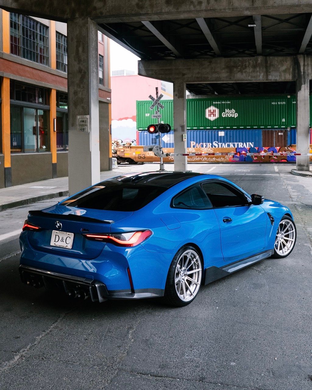 BMW M4 with Motivo Forged CS-U custom wheels in gloss polished clear face and brushed clear barrel rear side view