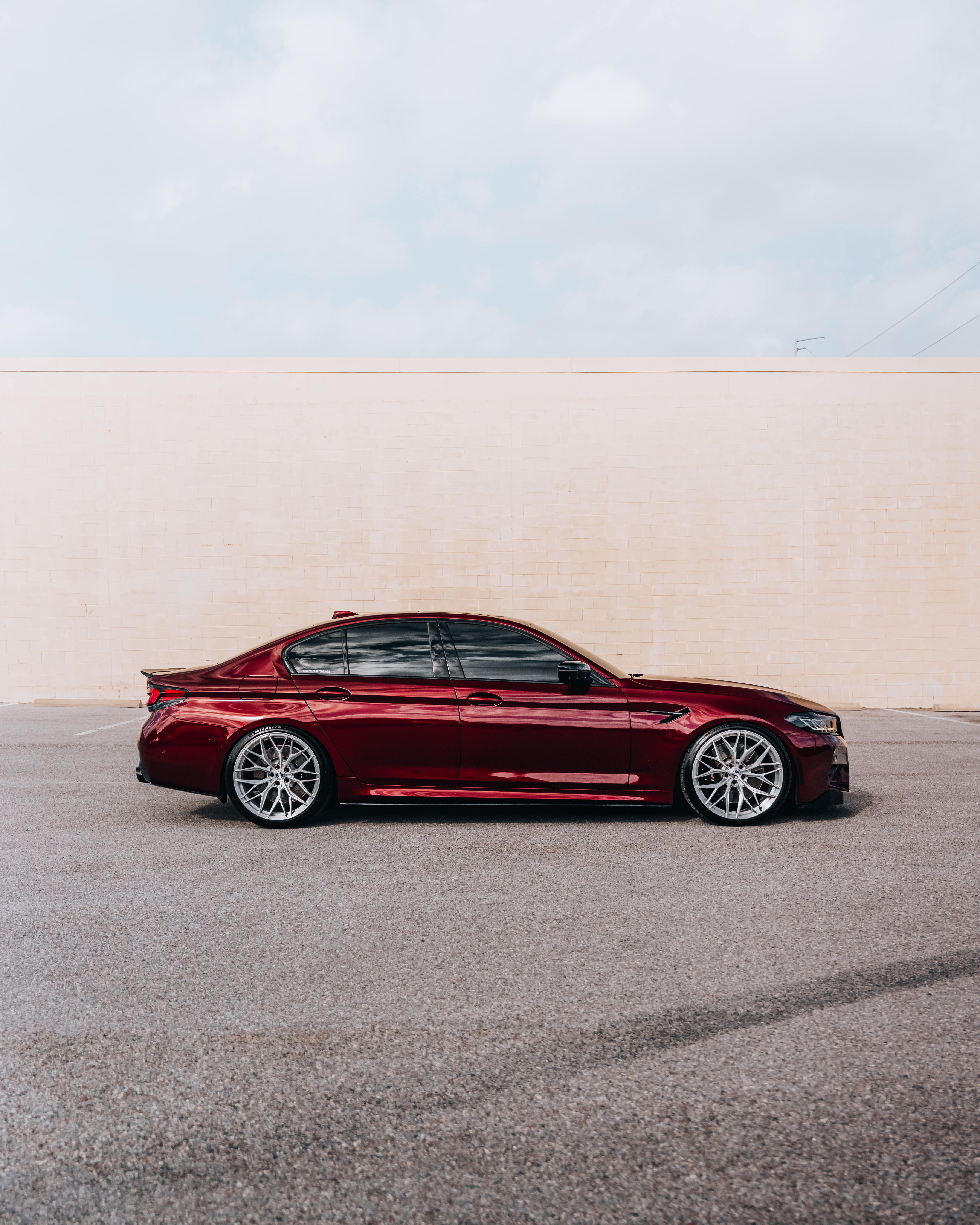 F90 BMW M5 LCI with Motivo Forged MB-E custom wheels in gloss brushed clear finish front side view — view 2