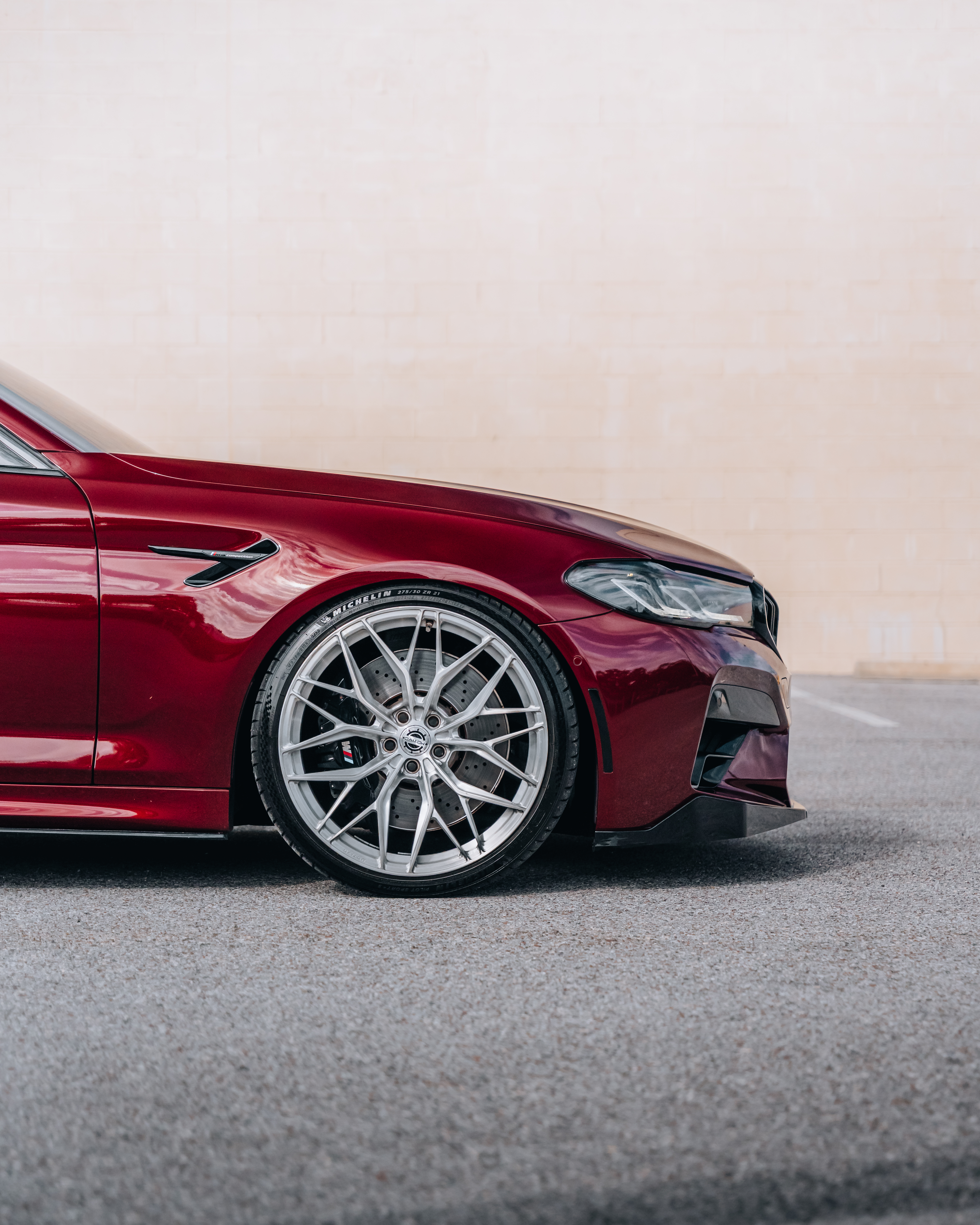 F90 BMW M5 LCI with Motivo Forged MB-E custom wheels in gloss brushed clear finish front side view — view 6