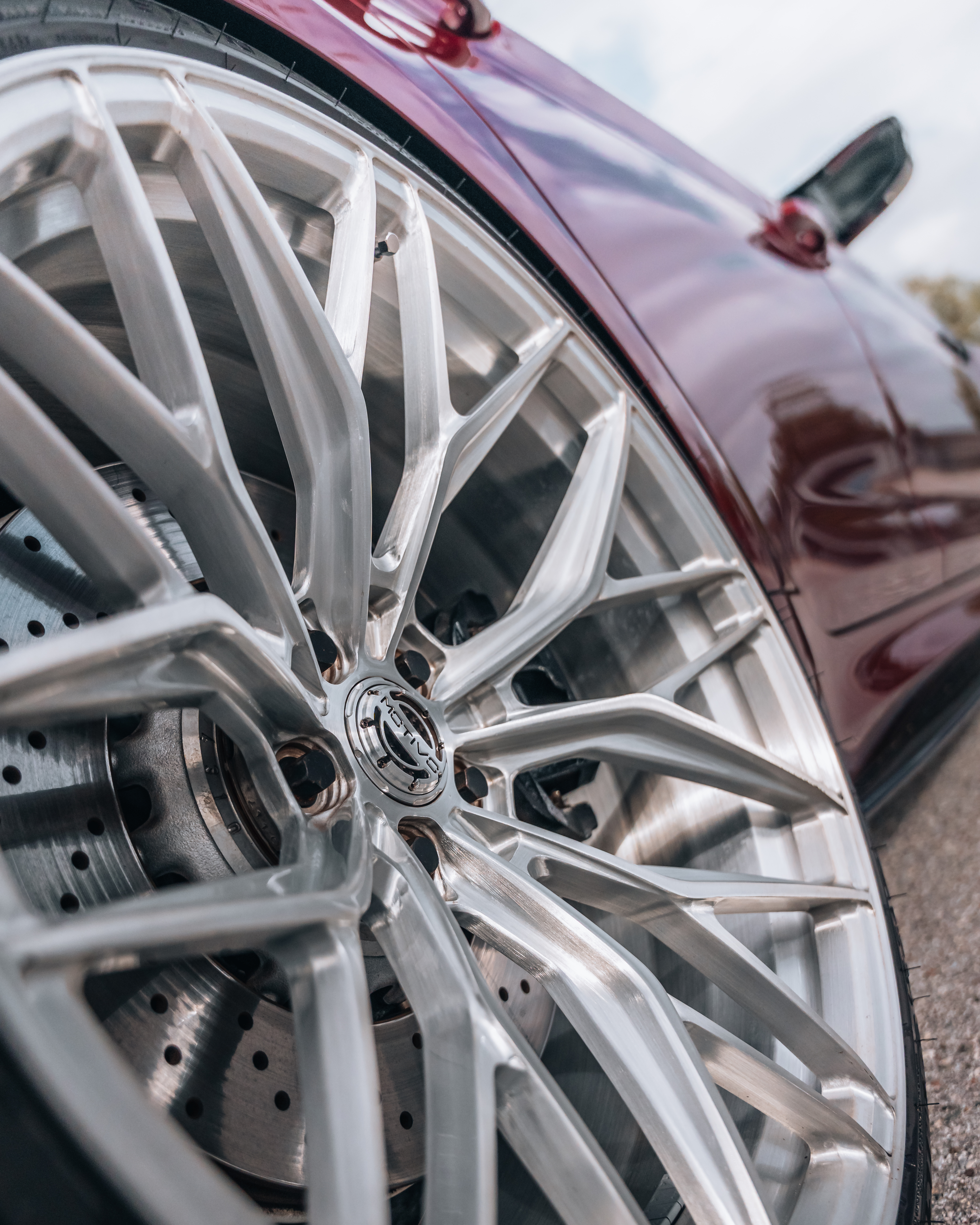 F90 BMW M5 LCI with Motivo Forged MB-E custom wheels in gloss brushed clear finish front side view — view 5