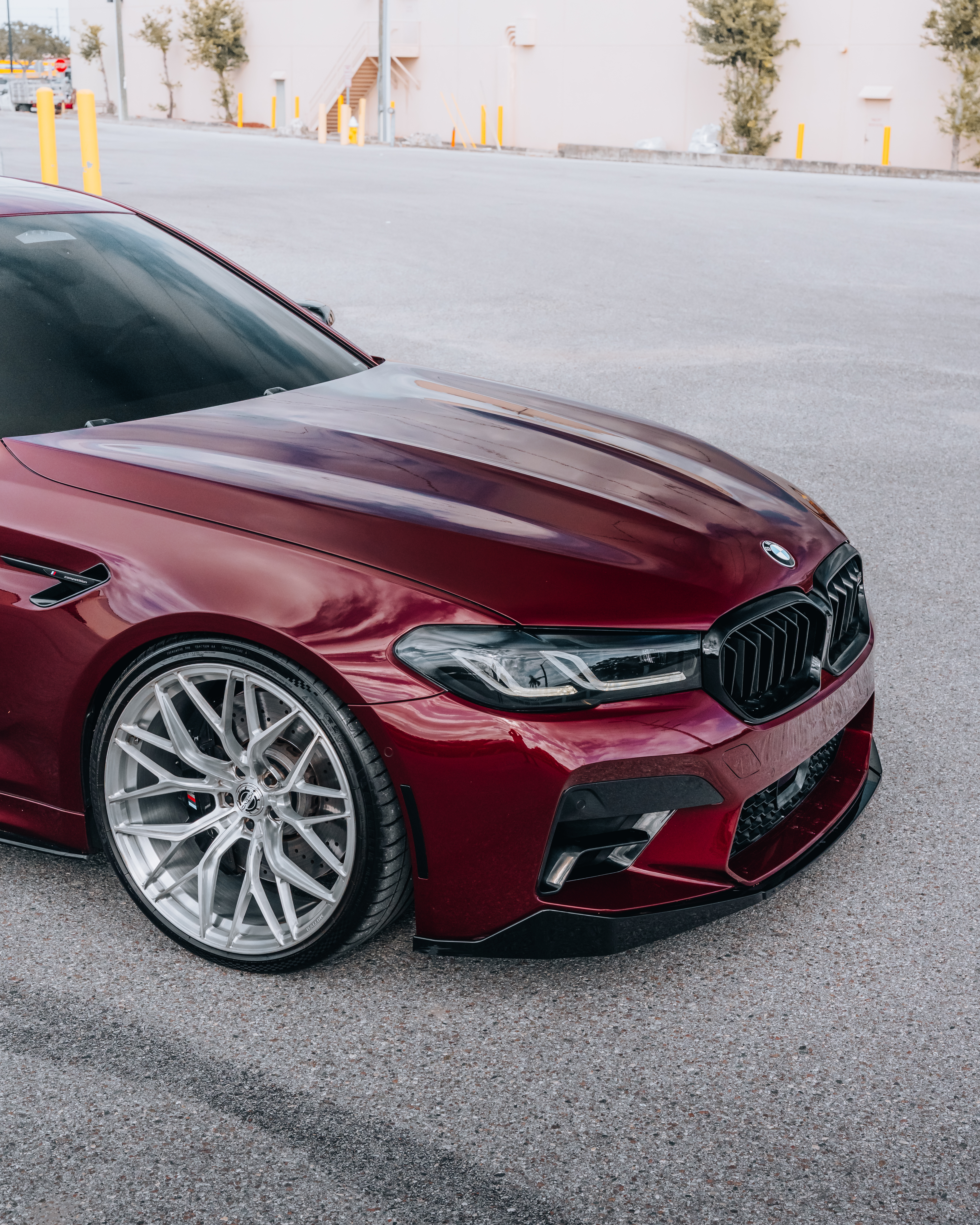 F90 BMW M5 LCI with Motivo Forged MB-E custom wheels in gloss brushed clear finish front side view — view 4